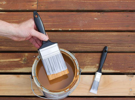 Deck being stained with stain or oil